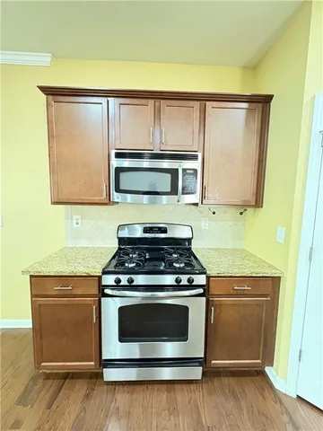 a view of a kitchen counter space and a sink