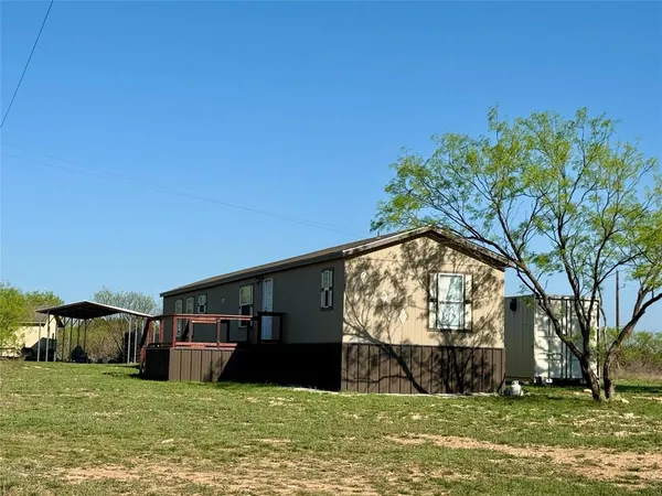 a view of a balcony with furniture