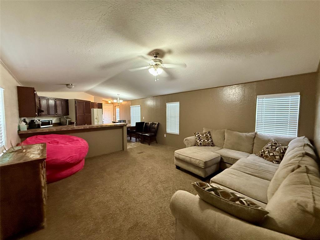 9455 County Road 189 Bangs, TX 76823 - Photo 19 of 40 a living room with furniture and kitchen view