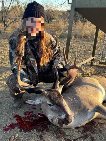 a view of a field with trees in the background