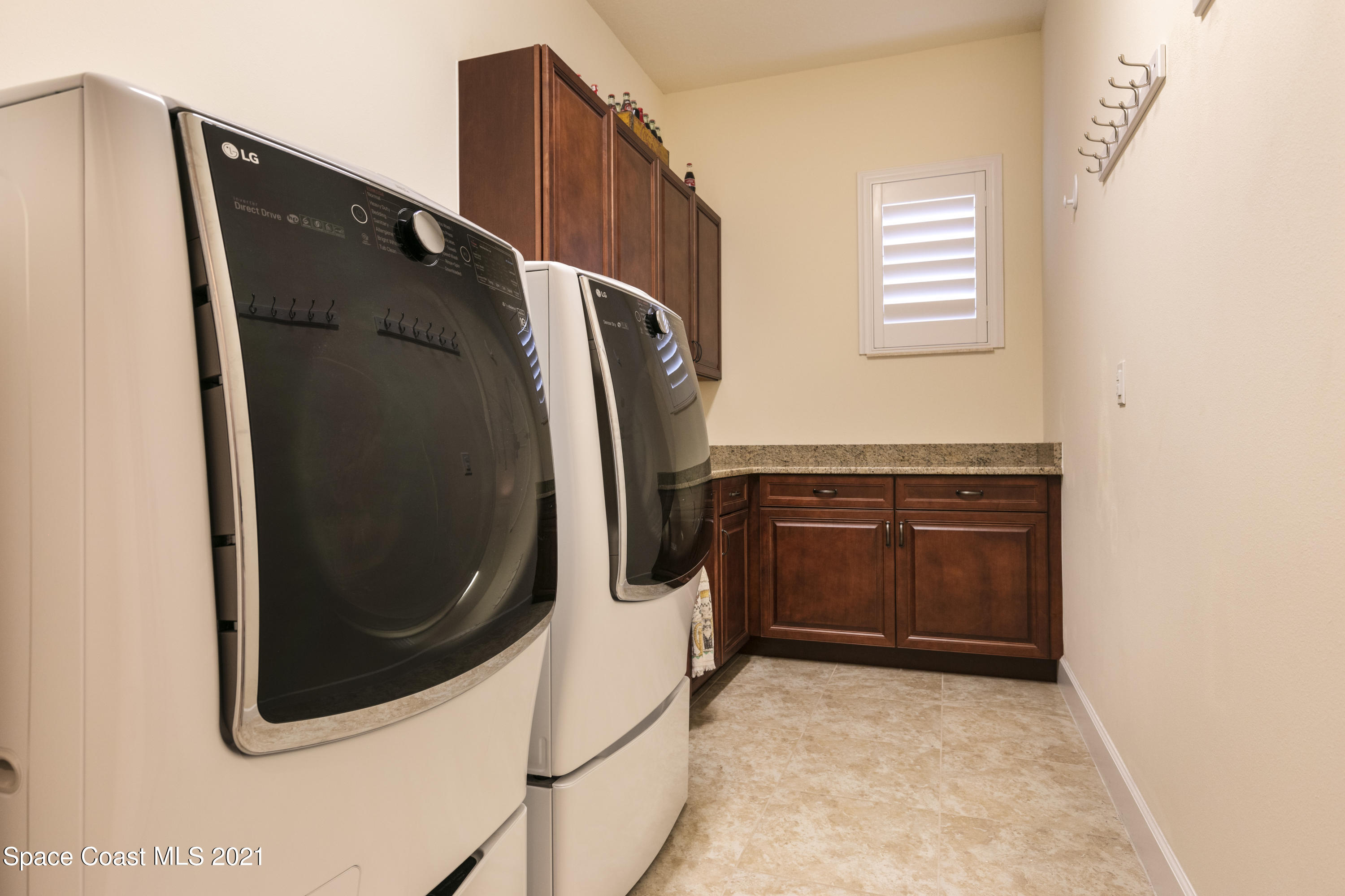 4584 Preservation Circle Melbourne, FL 32934 - Photo 16 of 34 a view of a utility room with washer and dryer