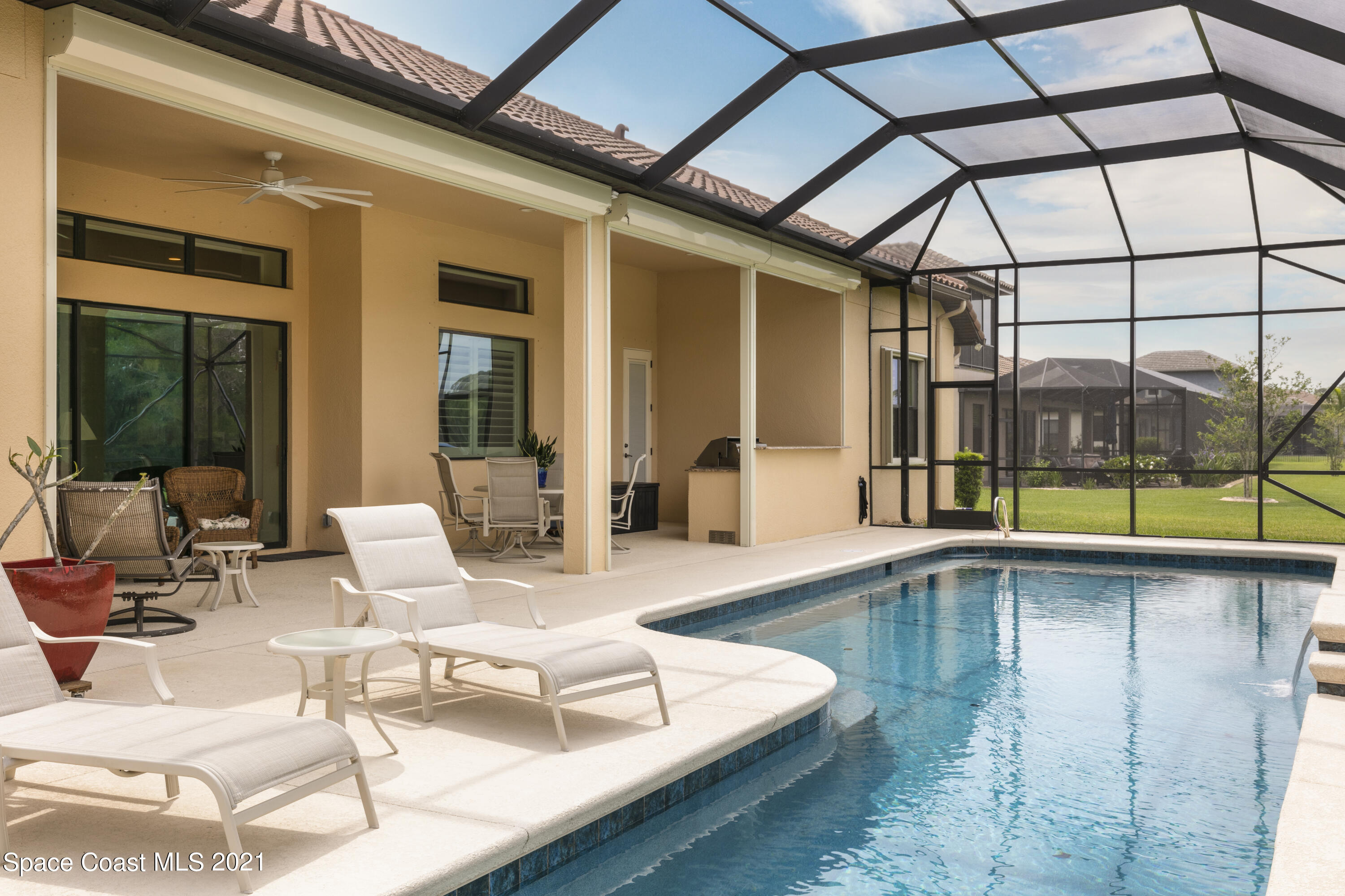 4584 Preservation Circle Melbourne, FL 32934 - Photo 23 of 34 a swimming pool with outdoor seating