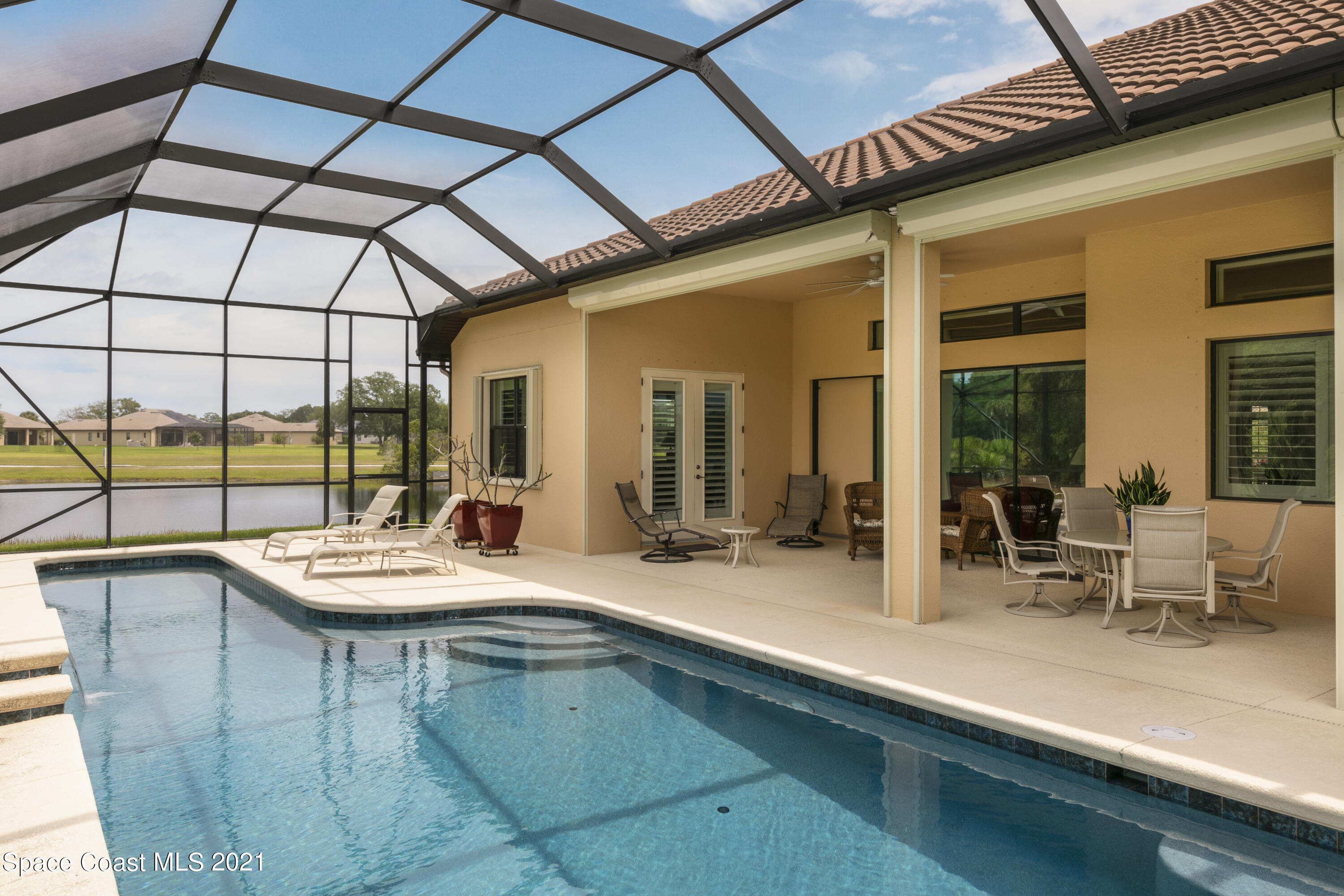 4584 Preservation Circle Melbourne, FL 32934 - Photo 26 of 34 a outdoor view of a house with outdoor seating