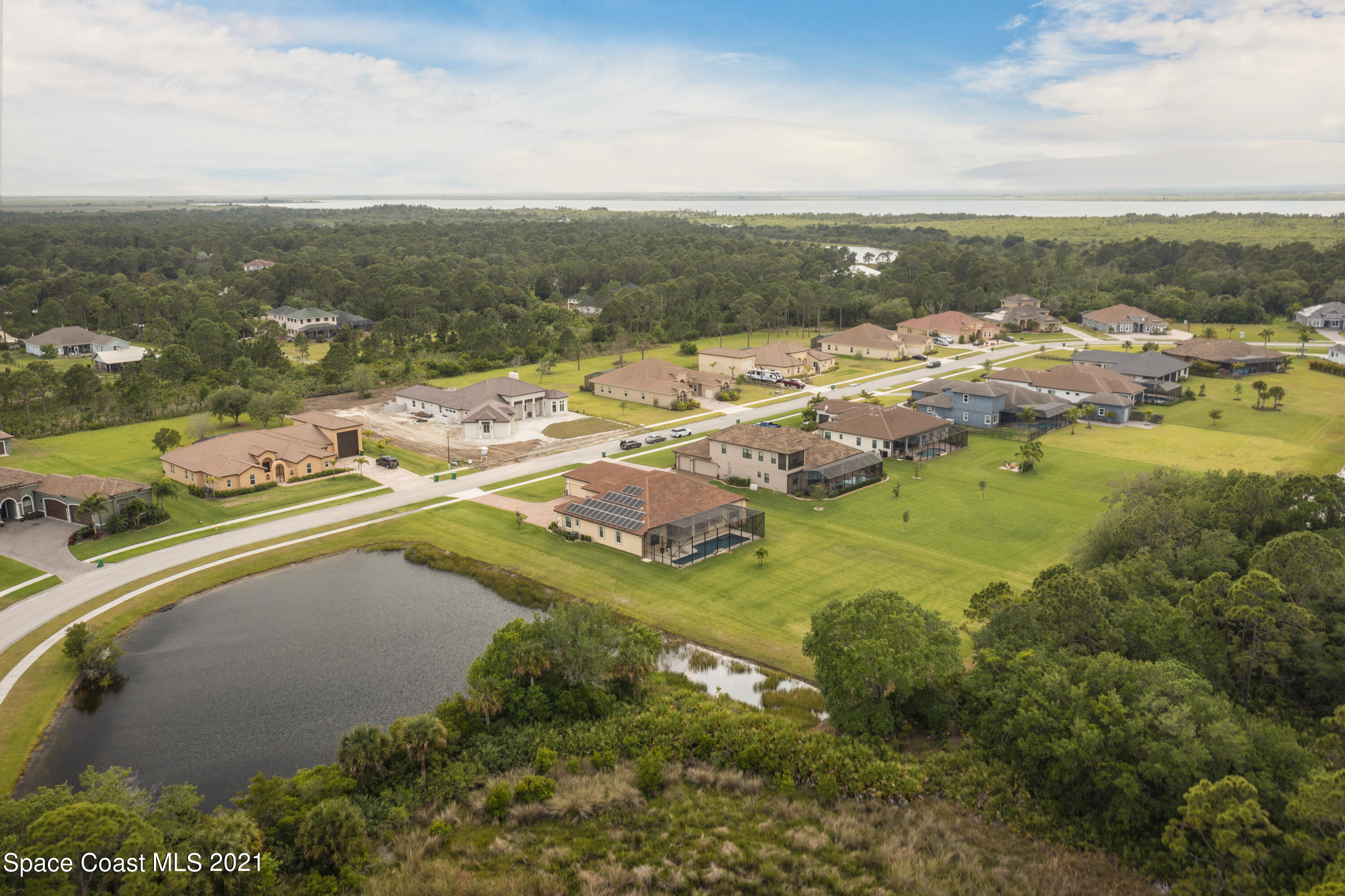 4584 Preservation Circle Melbourne, FL 32934 - Photo 29 of 34 a view of a lake with a mountain