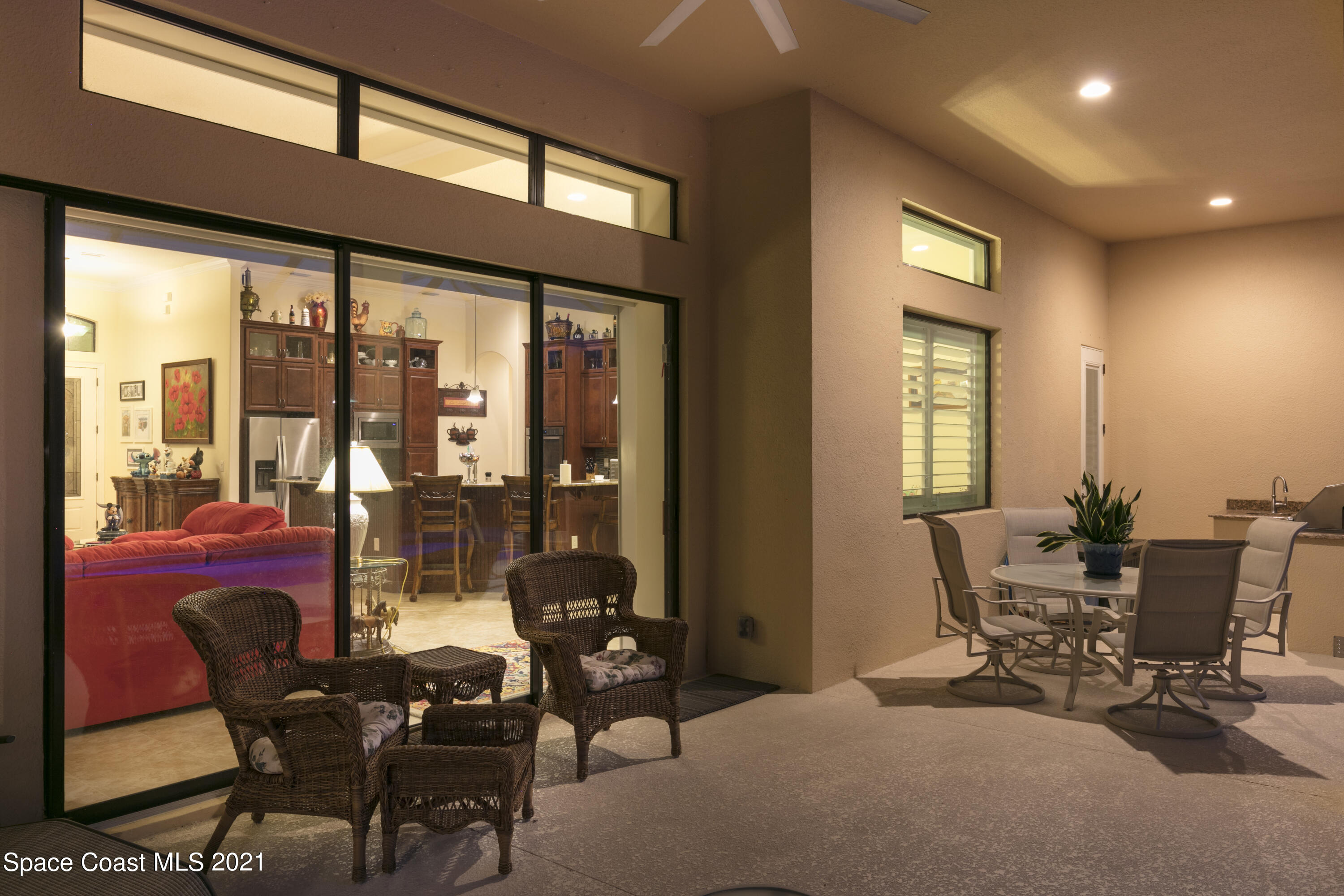 4584 Preservation Circle Melbourne, FL 32934 - Photo 31 of 34 a living room with furniture and large windows