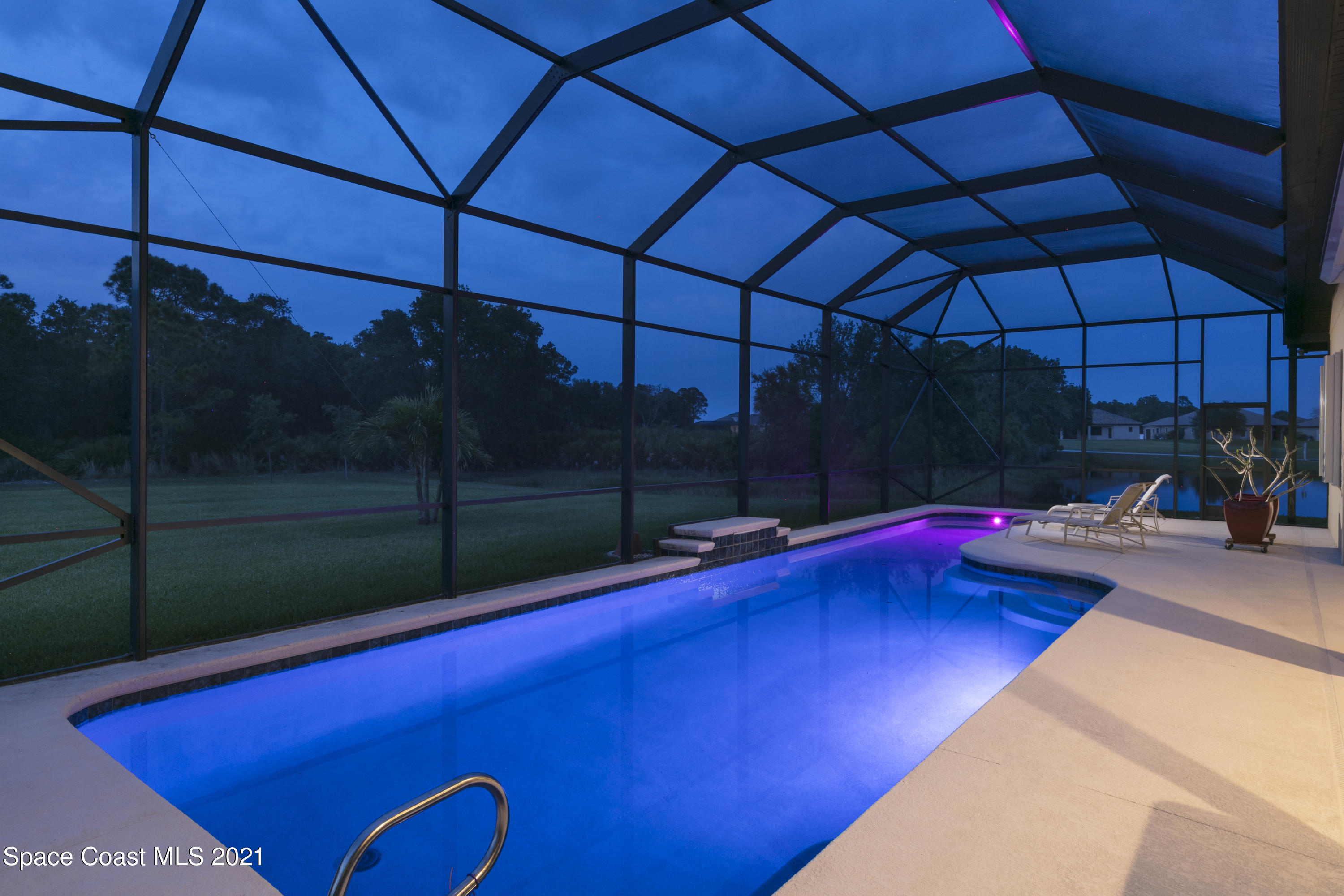 4584 Preservation Circle Melbourne, FL 32934 - Photo 33 of 34 a view of a pool with a patio
