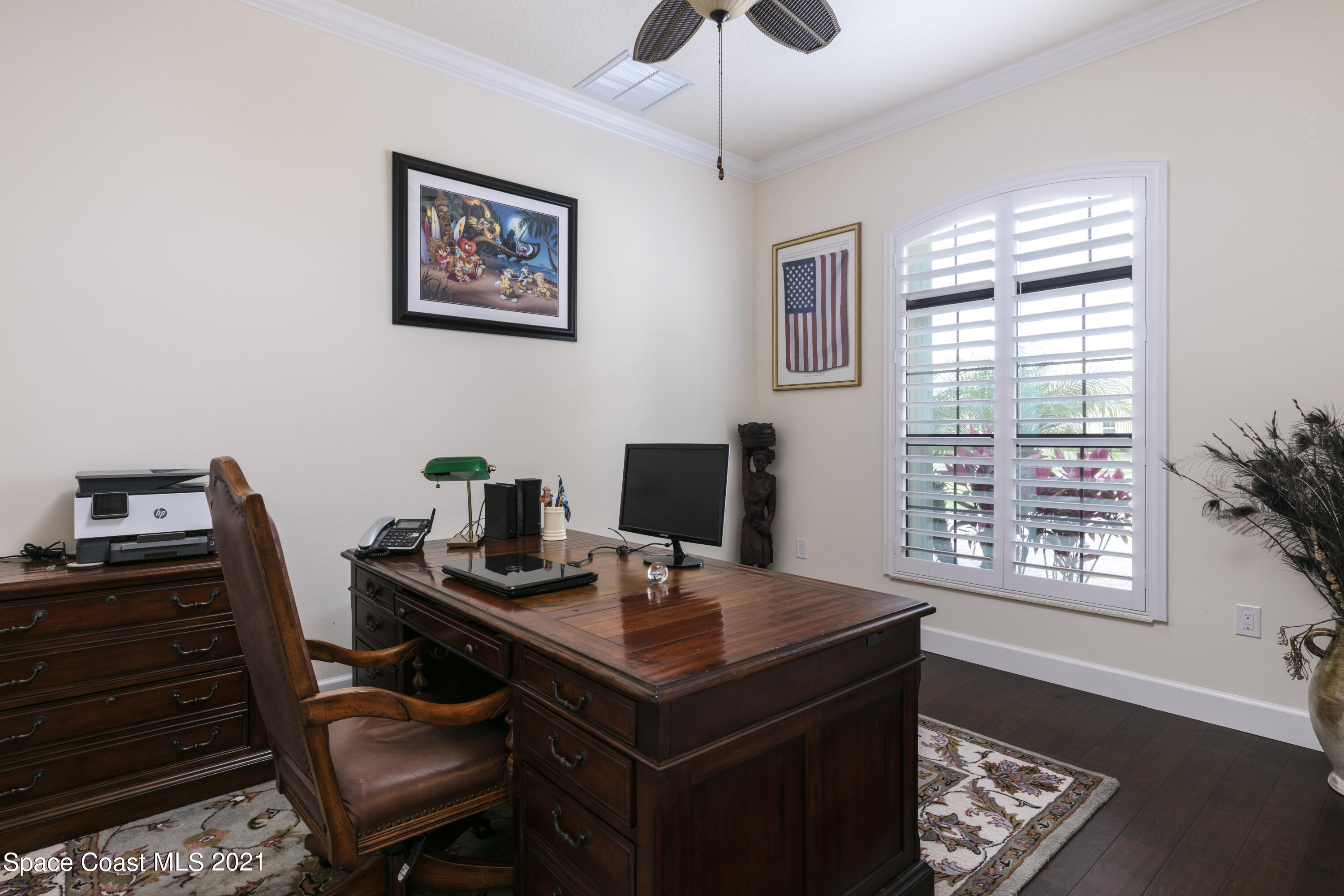 4584 Preservation Circle Melbourne, FL 32934 - Photo 8 of 34 a view of a workspace with furniture and a window