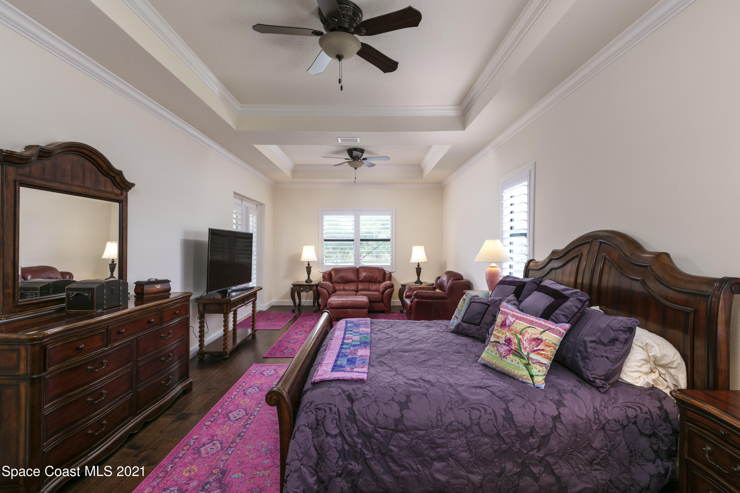 4584 Preservation Circle Melbourne, FL 32934 - Photo 10 of 34 a living room with furniture and a flat screen tv