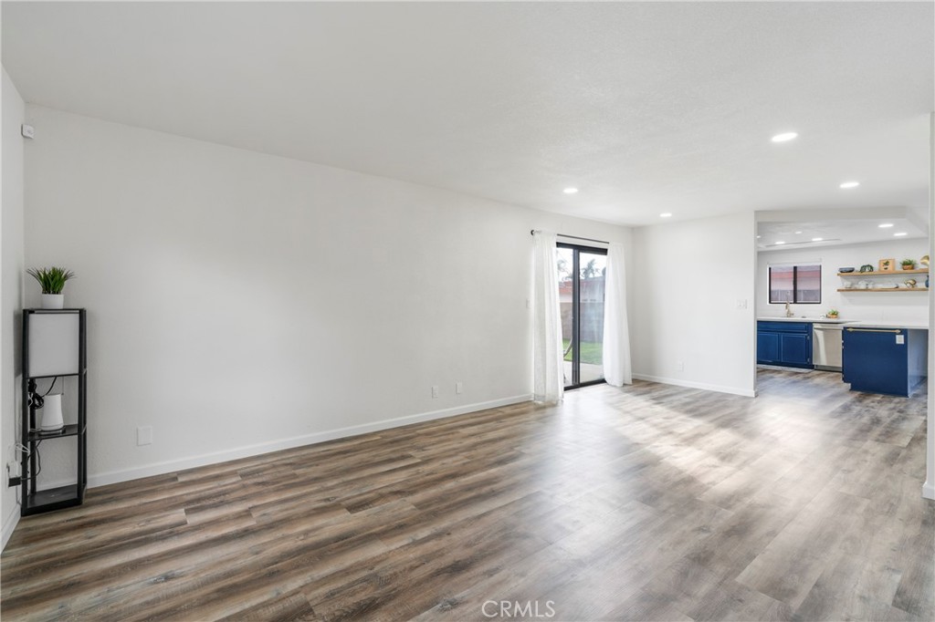 700 West 2nd Street Azusa, CA 91702 - Photo 12 of 75 a view of an empty room with wooden floor and windows
