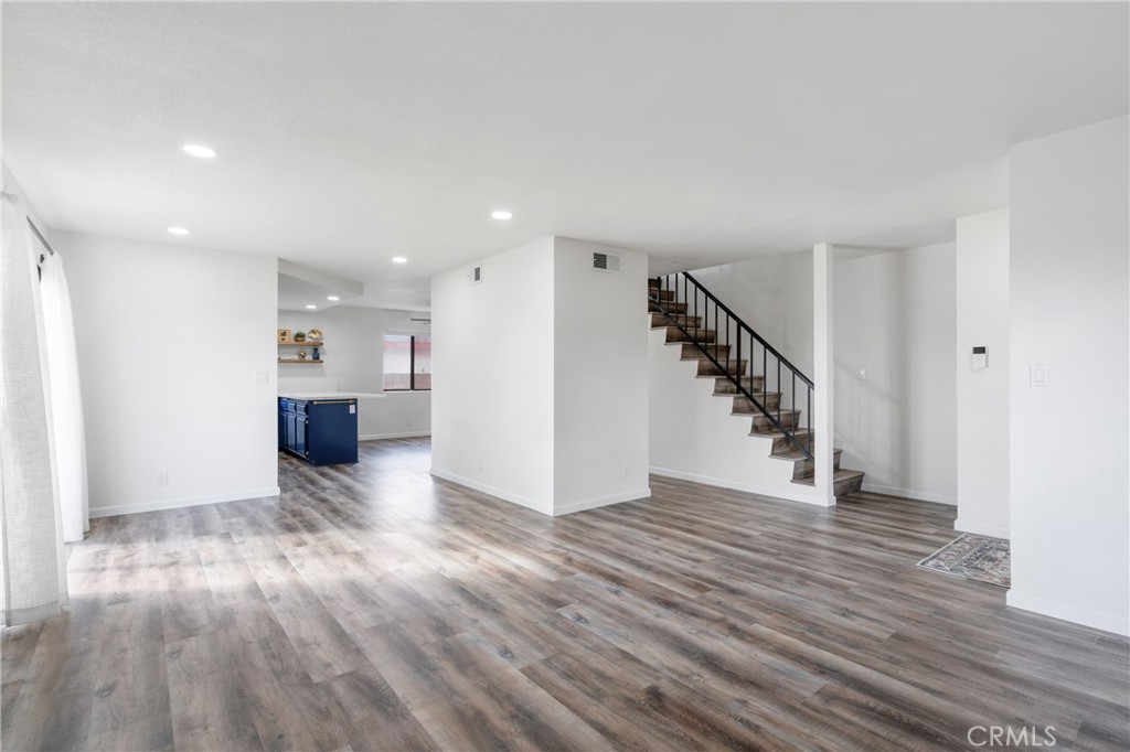 700 West 2nd Street Azusa, CA 91702 - Photo 13 of 75 a view of a hallway with wooden floor and a kitchen