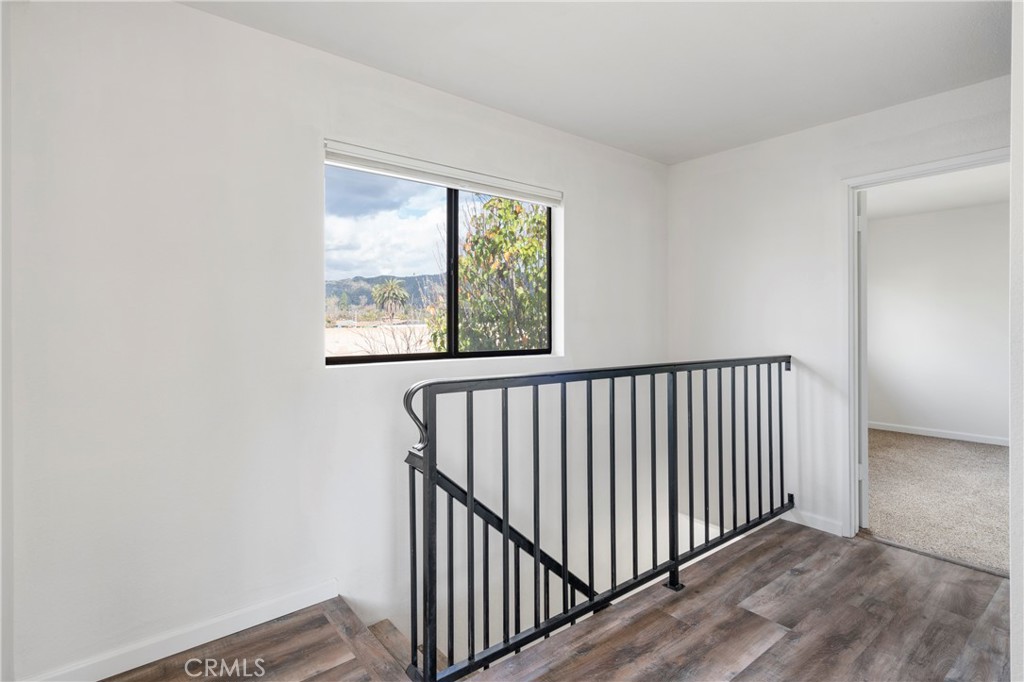 700 West 2nd Street Azusa, CA 91702 - Photo 15 of 75 a view of a hallway with wooden floor and a window