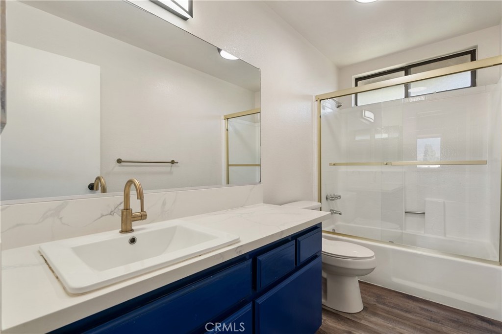 700 West 2nd Street Azusa, CA 91702 - Photo 16 of 75 a bathroom with a sink toilet a vanity and shower