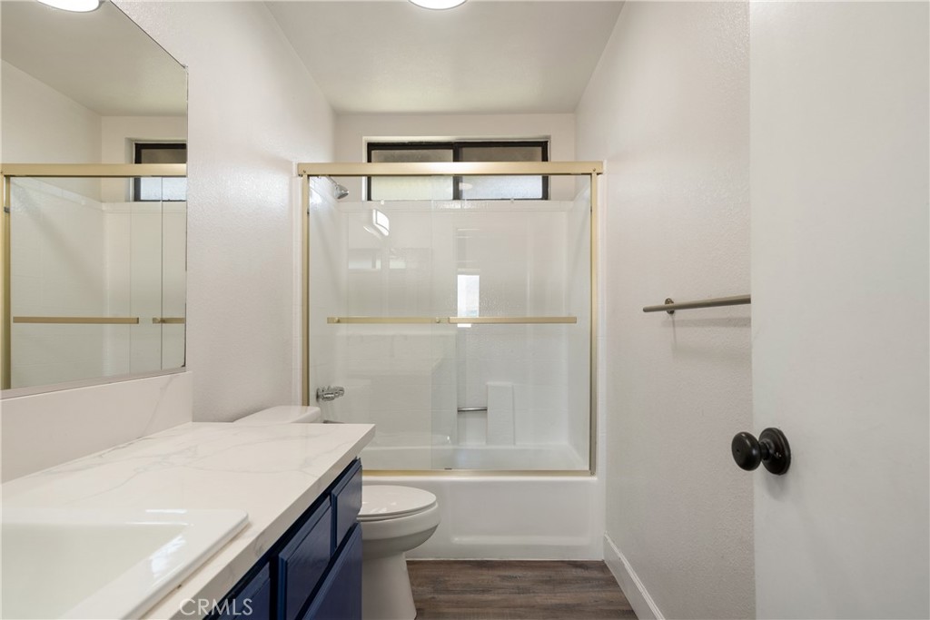 700 West 2nd Street Azusa, CA 91702 - Photo 17 of 75 a bathroom with a sink a toilet and shower