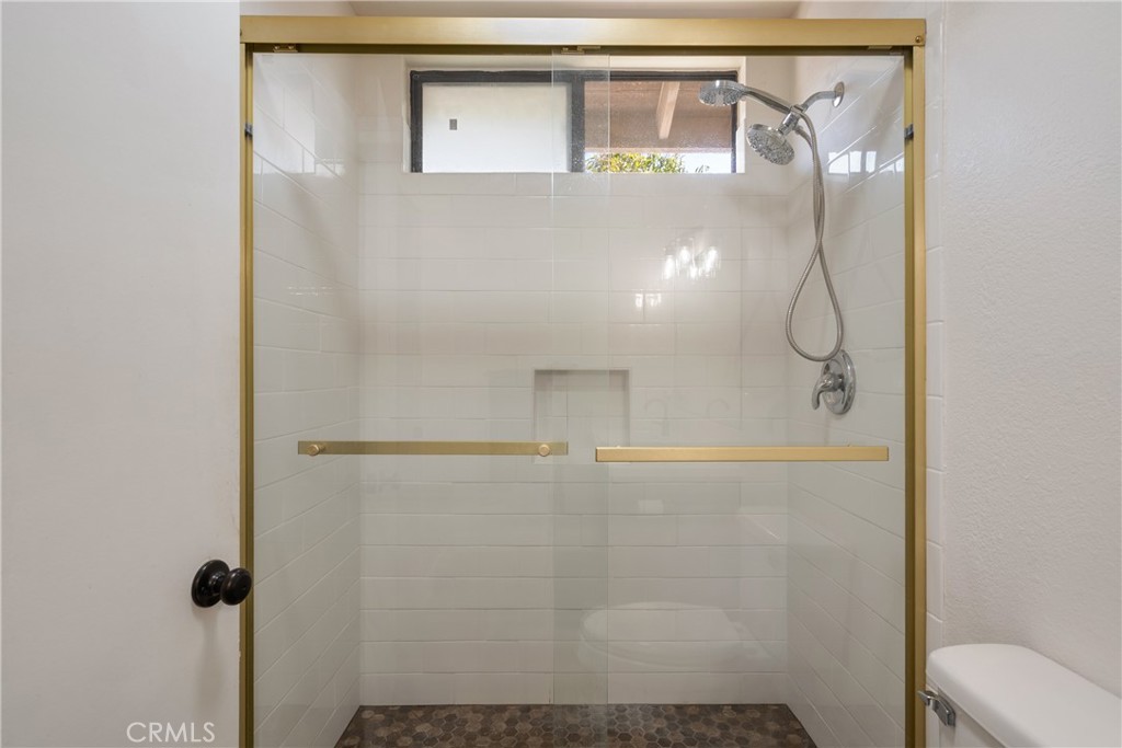 700 West 2nd Street Azusa, CA 91702 - Photo 20 of 75 a bathroom with a glass shower door