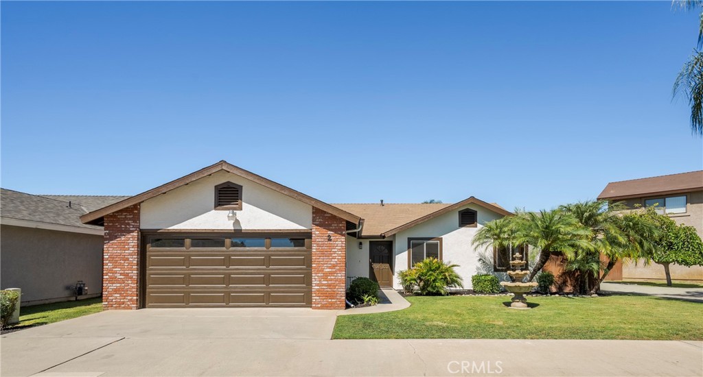 700 West 2nd Street Azusa, CA 91702 - Photo 25 of 75 a front view of a house with a yard