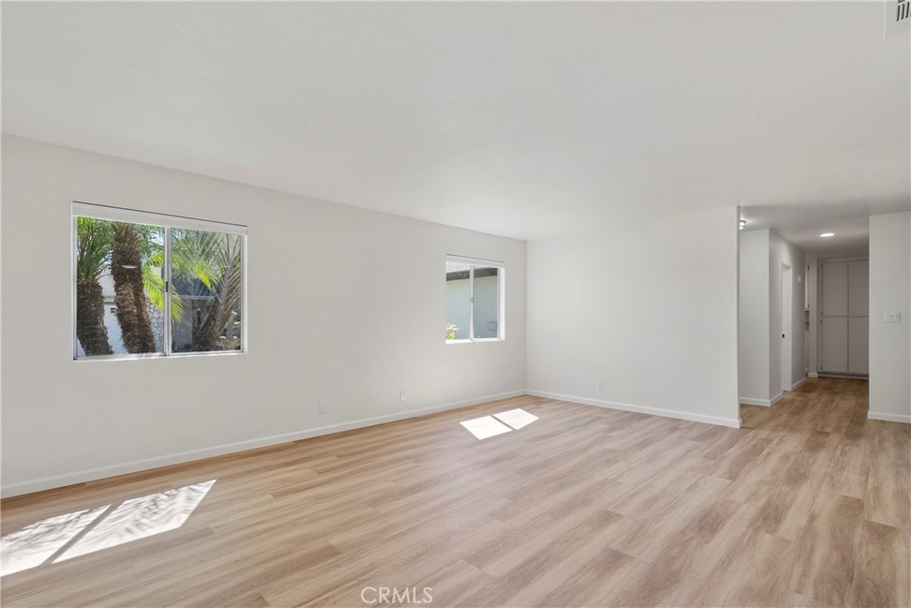700 West 2nd Street Azusa, CA 91702 - Photo 26 of 75 a view of an empty room with wooden floor and a window