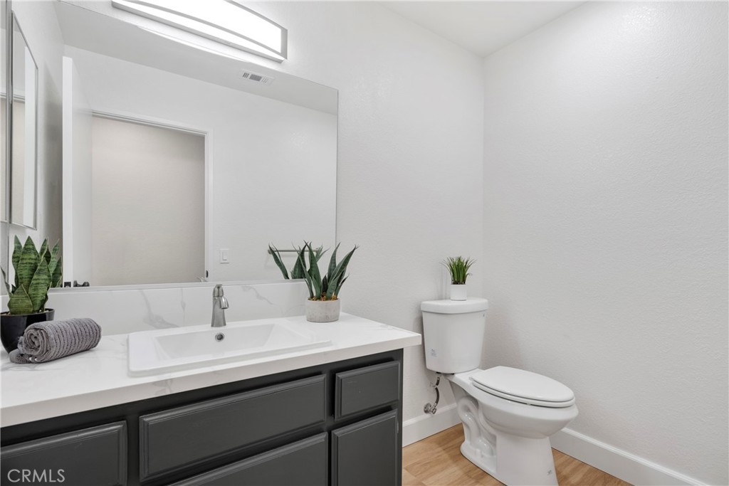 700 West 2nd Street Azusa, CA 91702 - Photo 34 of 75 a bathroom with a sink a toilet and potted plant