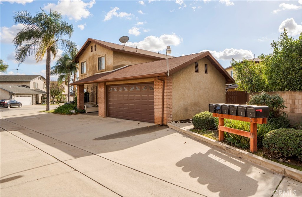 700 West 2nd Street Azusa, CA 91702 - Photo 46 of 75 a view of a house with a yard and potted plants