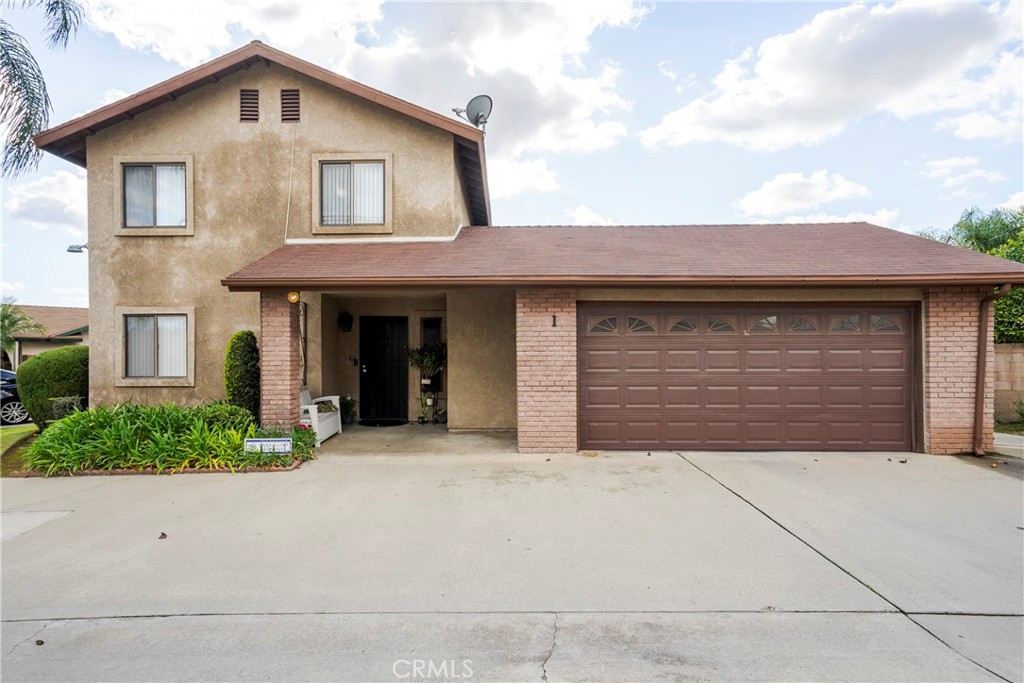 700 West 2nd Street Azusa, CA 91702 - Photo 47 of 75 a front view of a house with garage