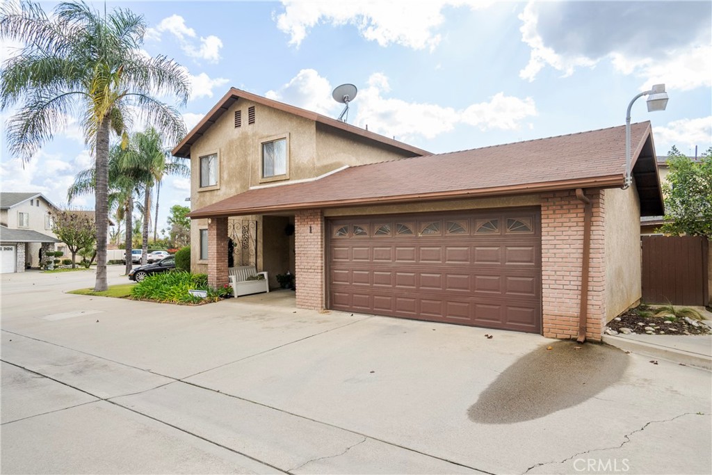 700 West 2nd Street Azusa, CA 91702 - Photo 48 of 75 a front view of a house with a yard and garage