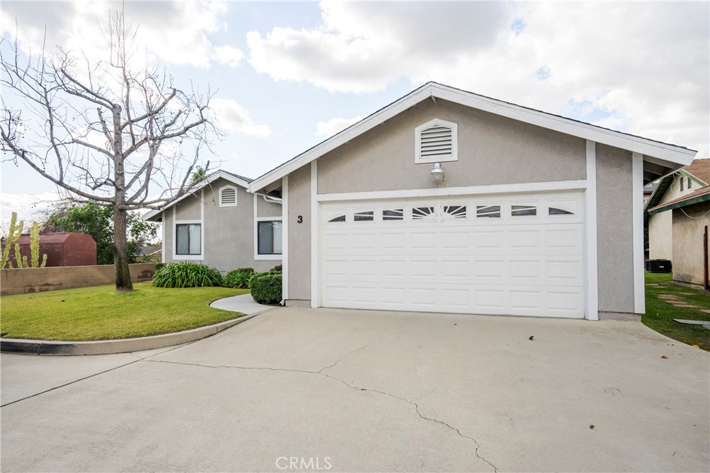 700 West 2nd Street Azusa, CA 91702 - Photo 51 of 75 a front view of a house with a yard and garage