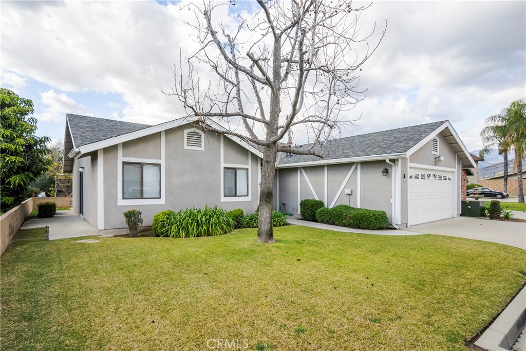 700 West 2nd Street Azusa, CA 91702 - Photo 52 of 75 a front view of house with yard and green space