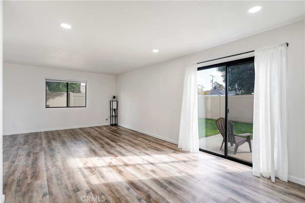 700 West 2nd Street Azusa, CA 91702 - Photo 10 of 75 a view of empty room with wooden floor and fan