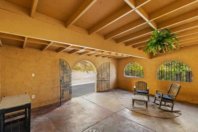 a spacious bathroom with a double vanity sink mirror and bathtub