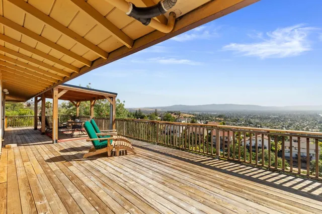 a view of a backyard with sitting area