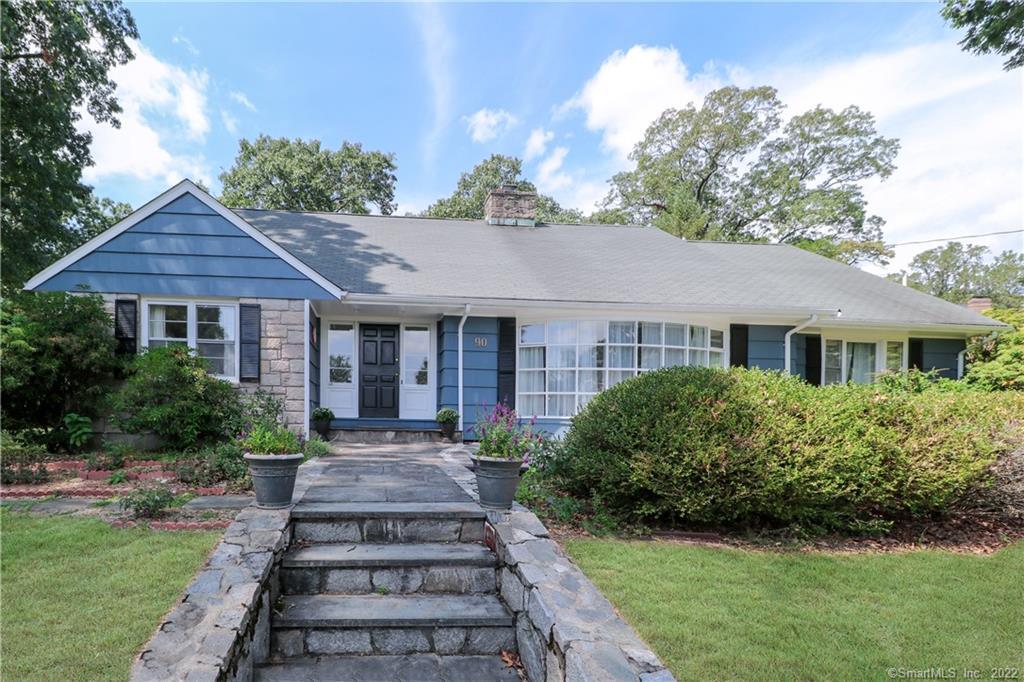 Spacious colonial cape in country club neighborhood with flexible floor plan.
