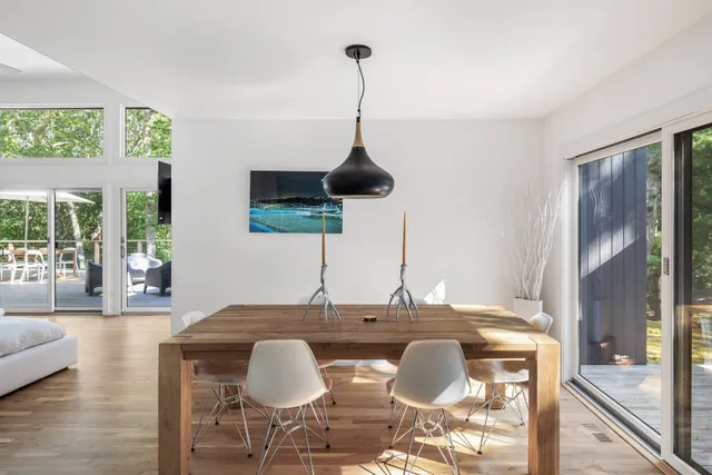 a dining room with furniture and window