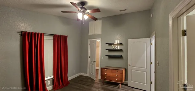 a front view of house with yard and trees all around