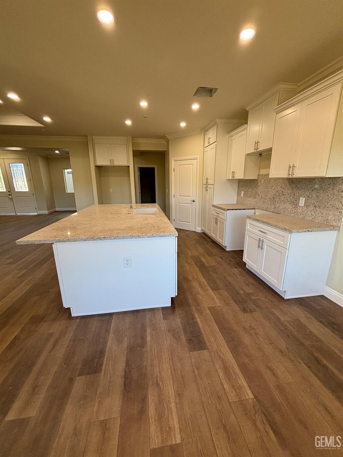 Undisclosed Address Tehachapi, CA 93561 - Photo 8 of 15 a large room with kitchen island a sink wooden floor and view living room