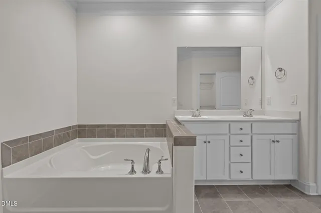 a bathroom with a bathtub and a sink