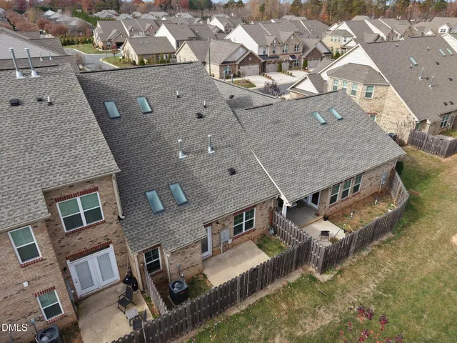 an aerial view of a house with outdoor space