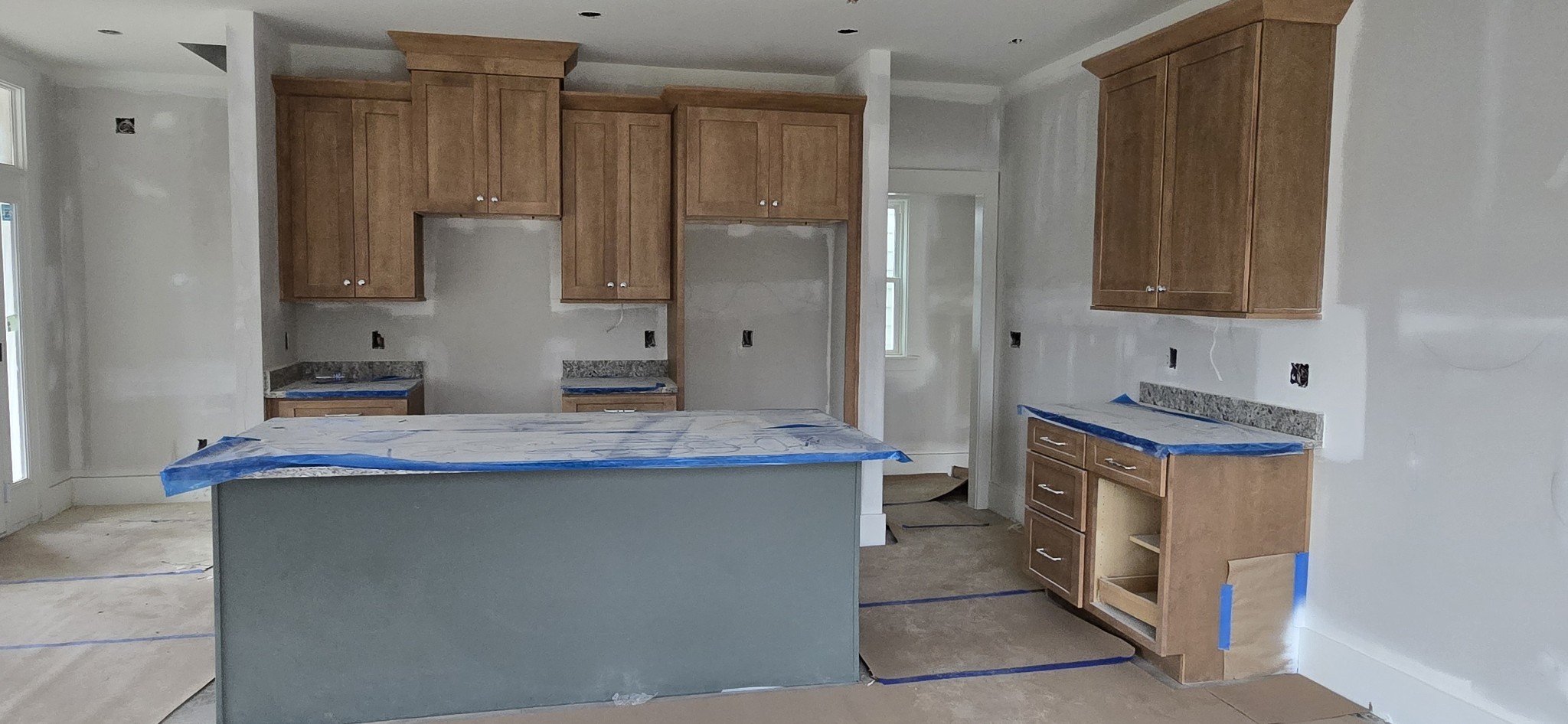 3043 A Hillside Road Nashville, TN 37207 - Photo 5 of 11 a kitchen with kitchen island granite countertop a sink stove and refrigerator