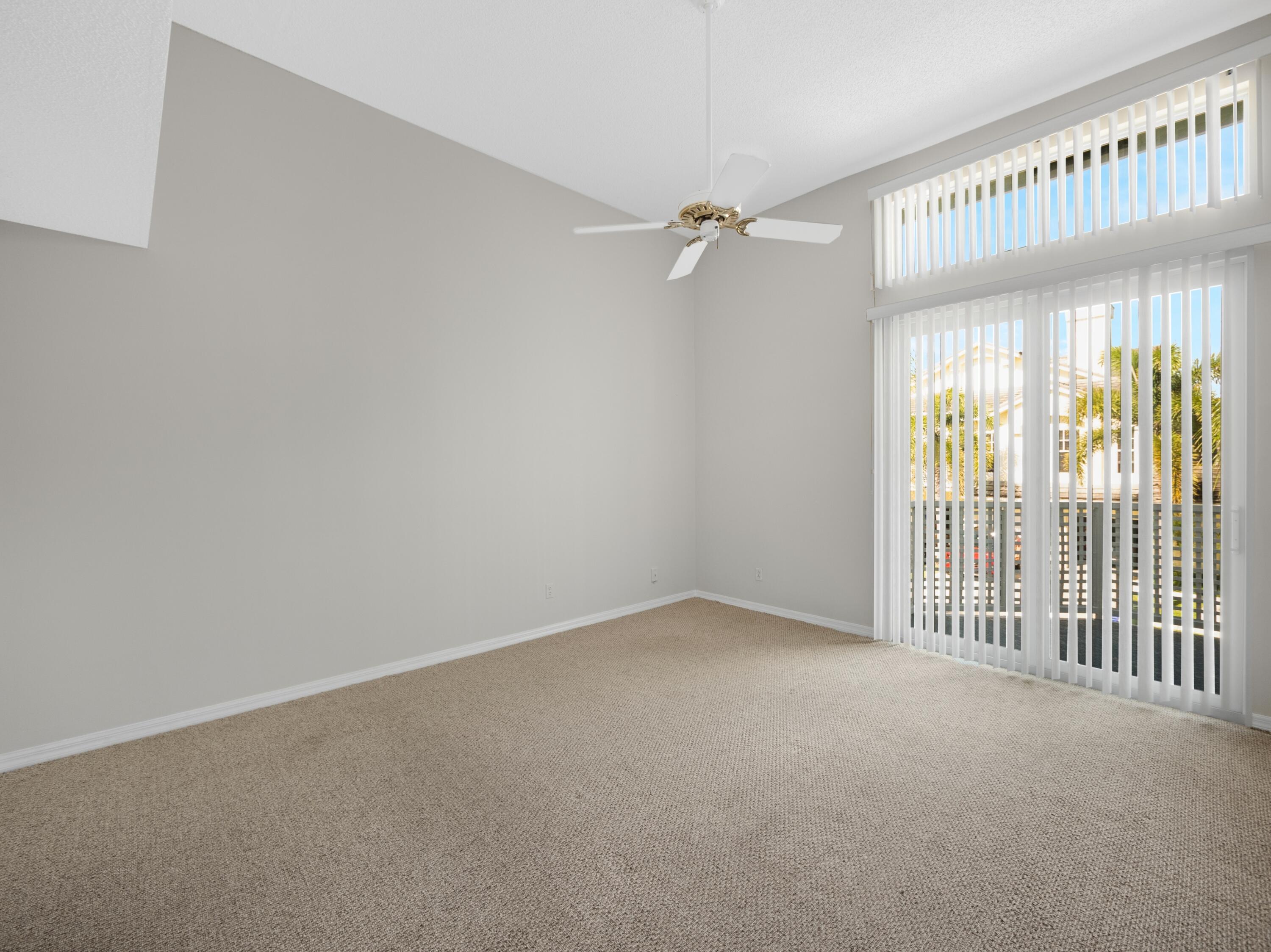 501 Mainsail Circle Jupiter, FL 33477 - Photo 8 of 29 a view of an empty room with a window
