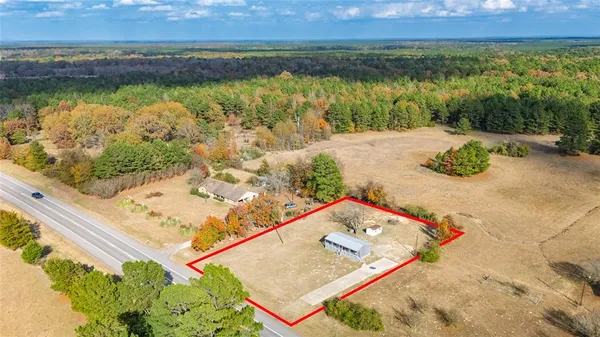 an aerial view of a house with a lake view