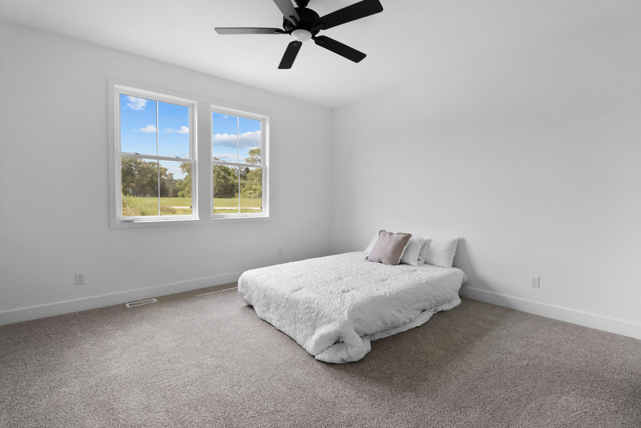 2183 Foley Street Portage, IN 46368 - Photo 13 of 22 a bedroom with a bed and window