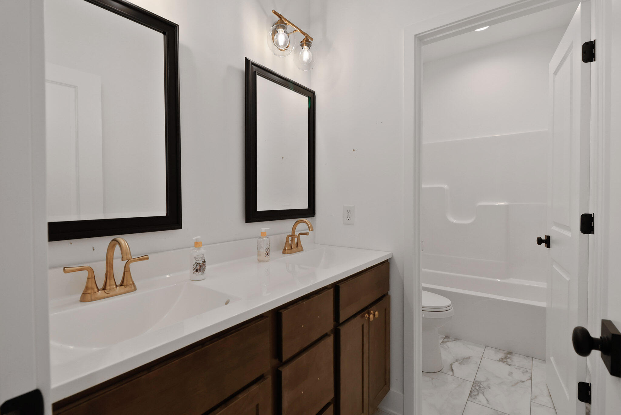 2183 Foley Street Portage, IN 46368 - Photo 19 of 22 a bathroom with a sink and a mirror