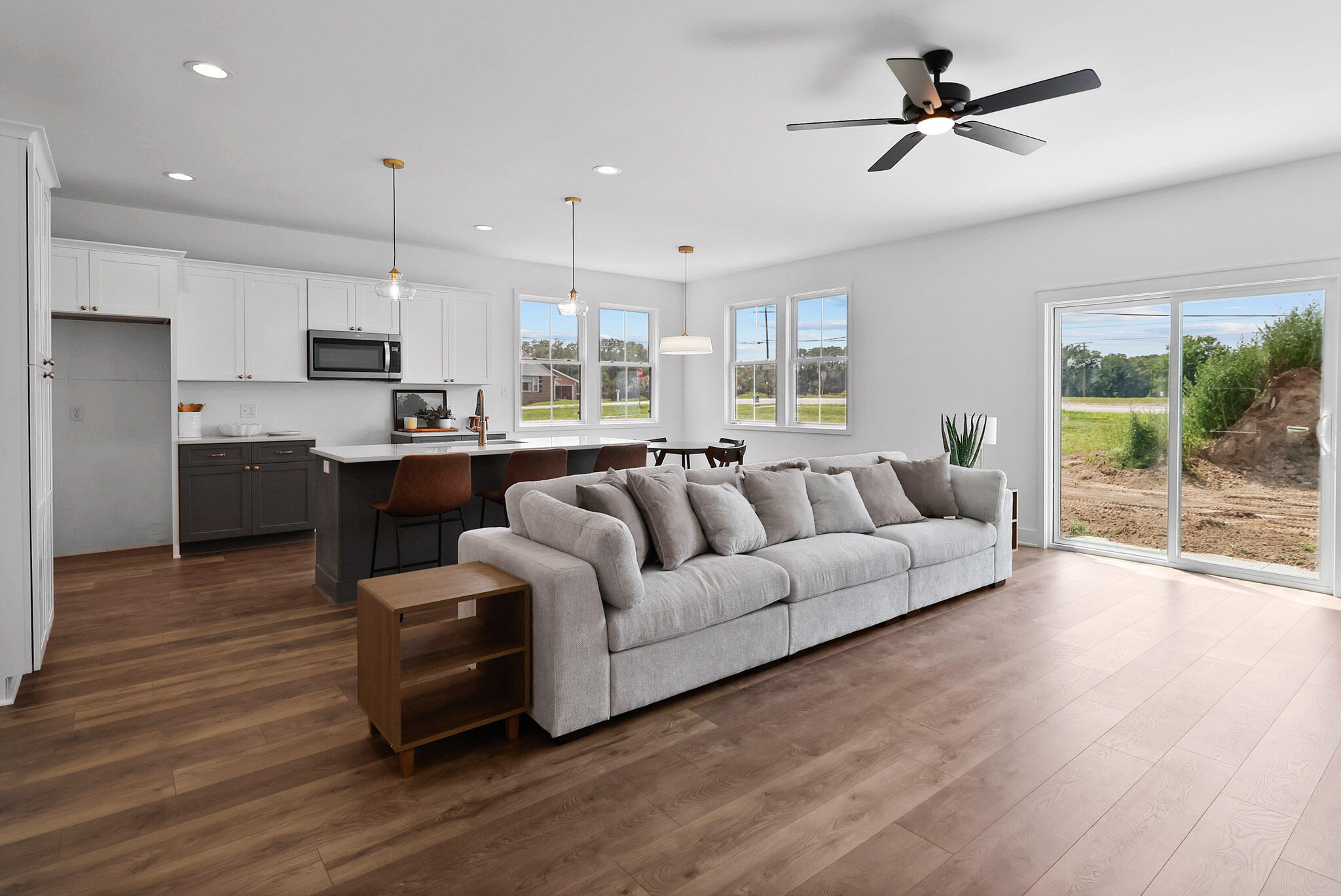 2183 Foley Street Portage, IN 46368 - Photo 6 of 22 a living room with stainless steel appliances kitchen island furniture and a wooden floor