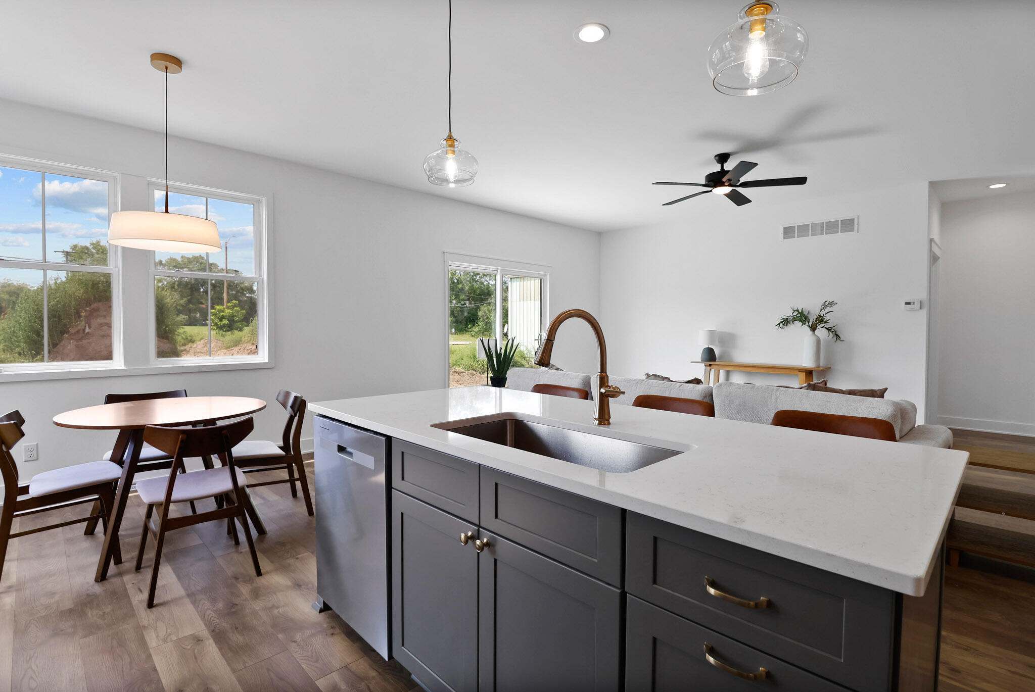 2183 Foley Street Portage, IN 46368 - Photo 9 of 22 a kitchen with a sink a counter and chairs