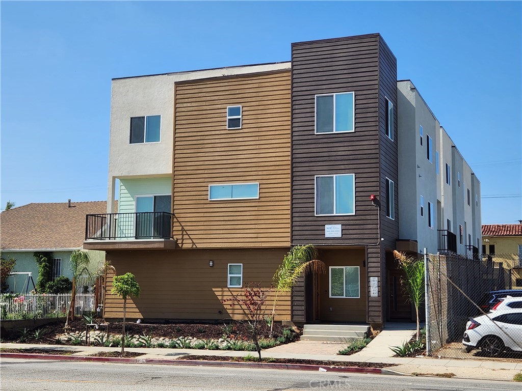 1491 Atlantic Avenue Long Beach, CA 90813 - Photo 1 of 1 a front view of a house with a garage