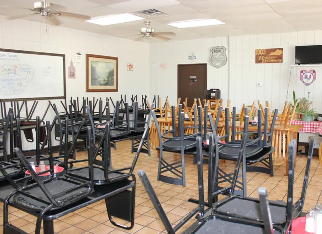 a kitchen with a sink a stove and refrigerator