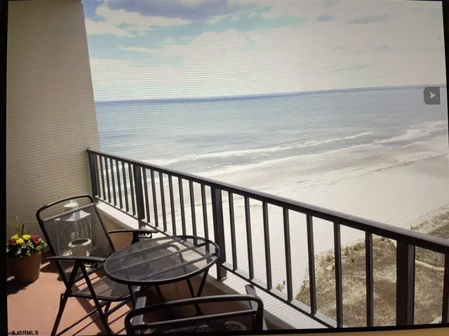 a view of a balcony with chairs