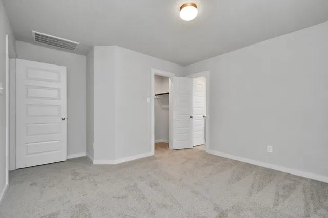 a bathroom with a sink a toilet and a large mirror