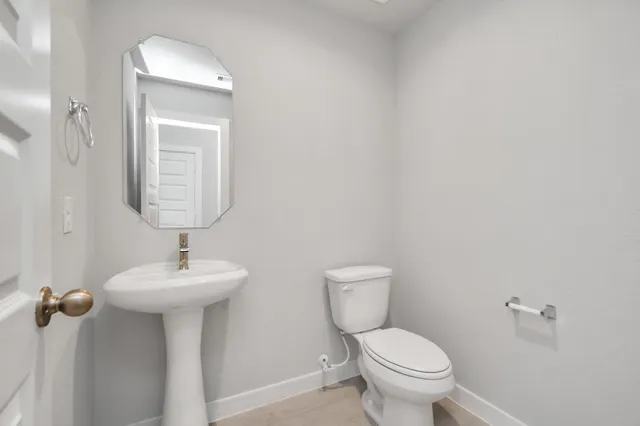 a bathroom with a sink a vanity and mirror