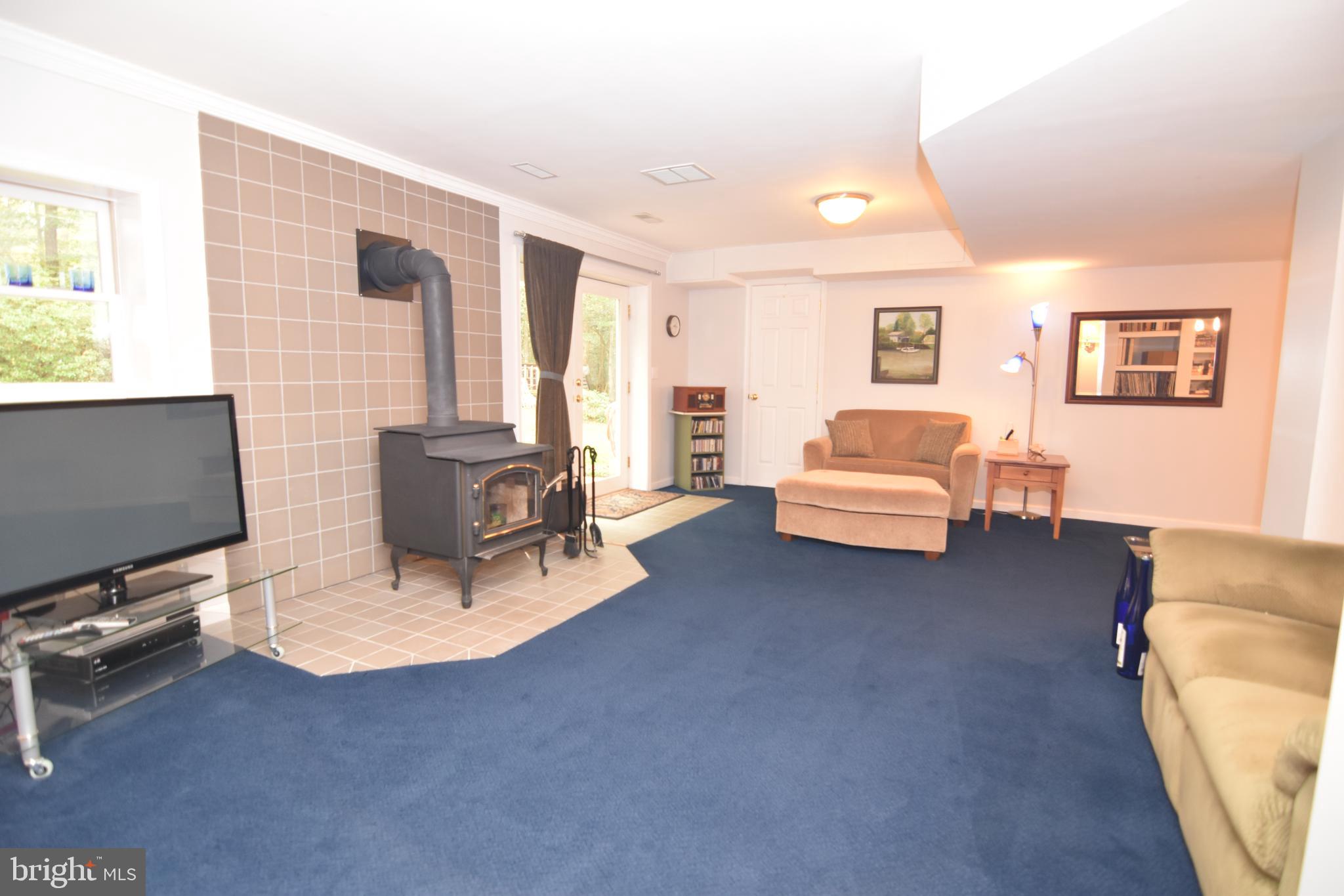17622 Point Lookout Road Lexington Park, MD 20653 - Photo 66 of 82 Basement has wood stove