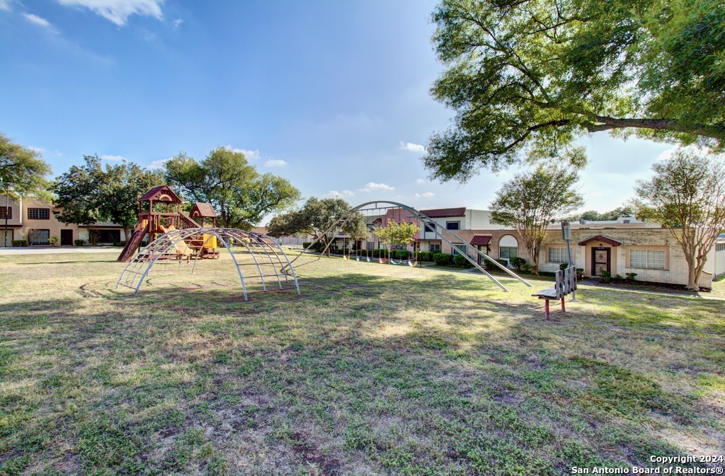 6810 Crown Ridge San Antonio, TX 78239 - Photo 9 of 34 a view of a park with swings and slides
