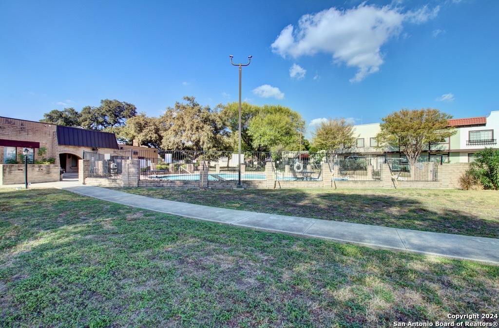 6810 Crown Ridge San Antonio, TX 78239 - Photo 10 of 34 a view of a building with a yard